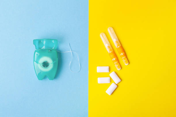 istock Tools for dental care: orthodontic brush, floss, toothpaste. Invisible dental aligners modern tooth brackets transparent braces to straighten teeth in cosmetic dentistry and orthodontics 1077635250