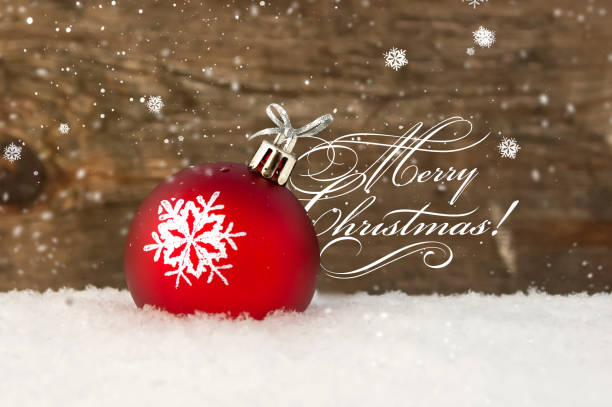 istock Red Christmas ball in snow 1077637210