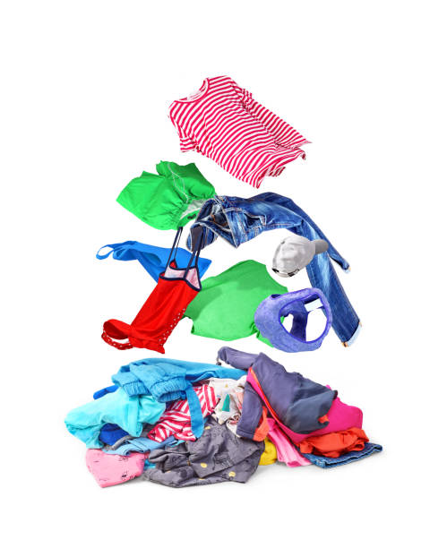 istock A backpack with colorful things that fly out of it and fall on a pile, isolated on a white background. 1077638414