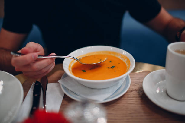 istock Pumpkin cream soup on a table in a restaurant 1077639612