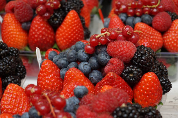 istock blueberries, currant, strawberries and raspberries 1077643822