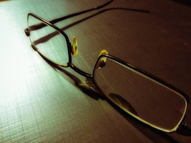 istock glasses on a dark background, shadow of the rim 1077644040