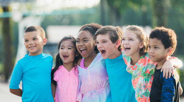 istock Six multi-ethnic children standing at swimming pool 1077645734