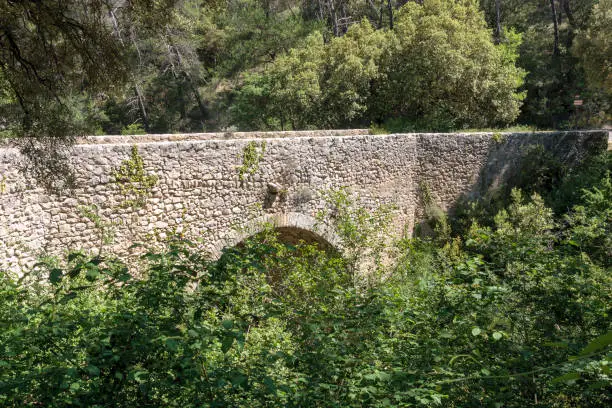 Old Roman bridge near the village of Lurs in Provence France