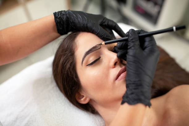 Cosmetician preparing to make a legit appearance of naturally full brows