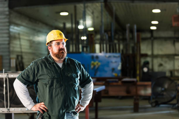 istock Mature man in metal fabrication plant 1077650938