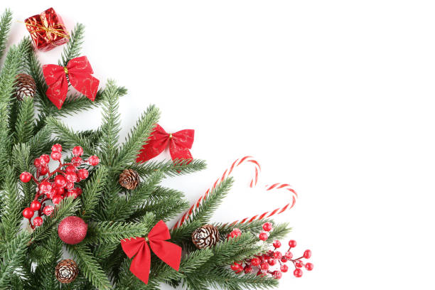 istock Christmas fir tree branches with decorations on white background 1077653186
