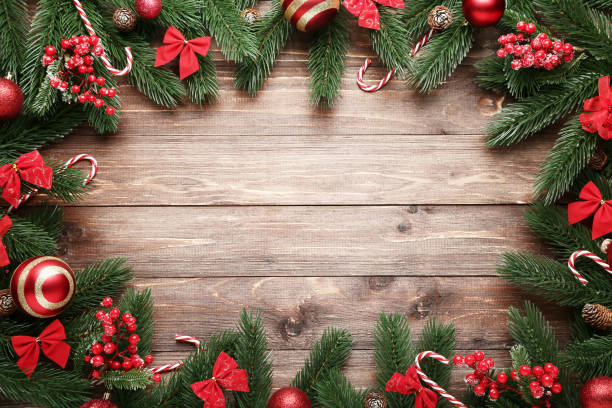 istock Christmas decorations on brown wooden table 1077653322