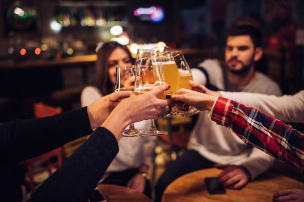 istock Friends having a toast in pub 1077659052