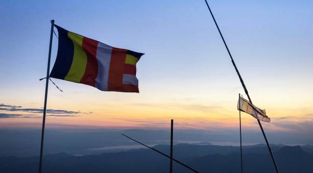 istock Buddhist Religion Flags On Blue Sky Background , Myanmar 1077662992