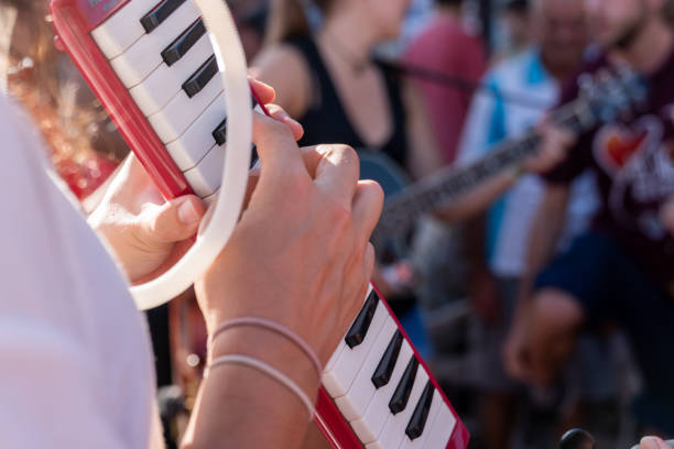 istock Crop person playing melodica 1077665098