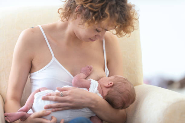 istock Mother breastfeeding her newborn baby 1077665316