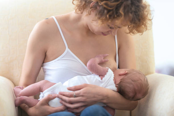 istock Mother breastfeeding her newborn baby 1077665322