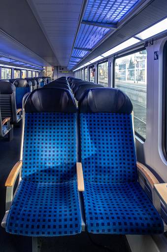 These blue dotted seats are used by the Deutsche Bahn on regional trains and commuter trains. This picture was taken in Ahrensburg, Germany.