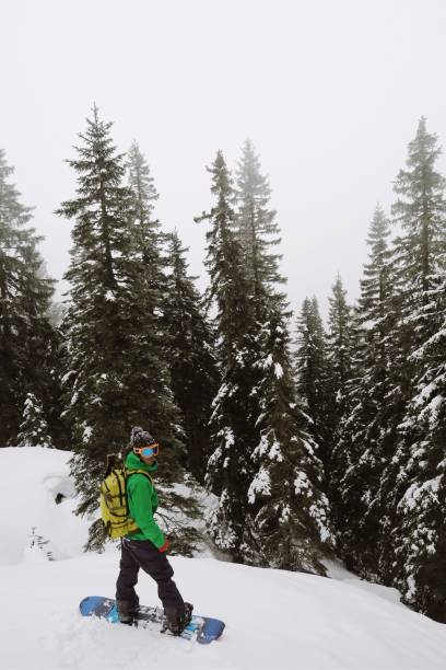 istock Young snowboarder enjoying in some fresh deep powder in the Alps 1077665962