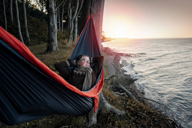 istock Woman lying in a hammock relaxing. 1077665974