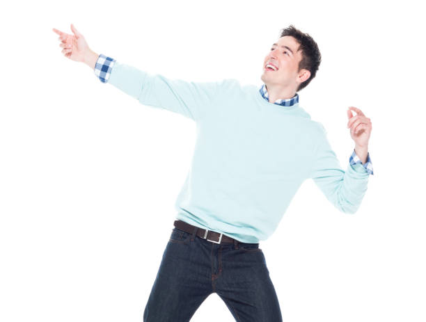 istock Handsome young man looking up in surprise 1077667574