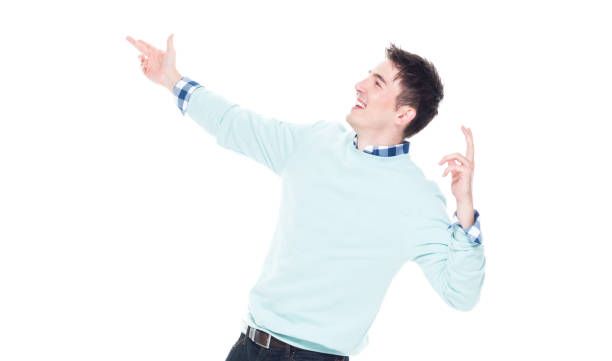 istock Handsome young man looking up in surprise 1077667590
