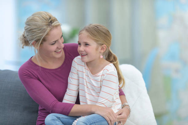 istock Mother and daughter hugging 1077668496