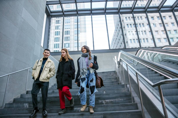 istock Friends walking down the steps of a building 1077670056