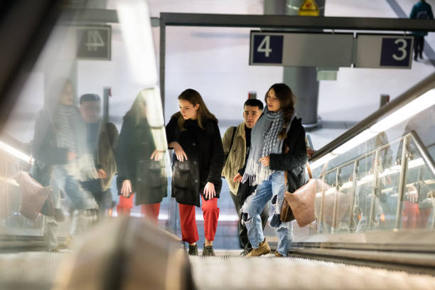 istock Friends on escalator at subway station 1077670164