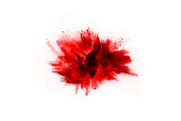 istock Freeze motion of red powder exploding, isolated on white background. Abstract design of red dust cloud. Particles explosion screen saver, wallpaper 1077671580