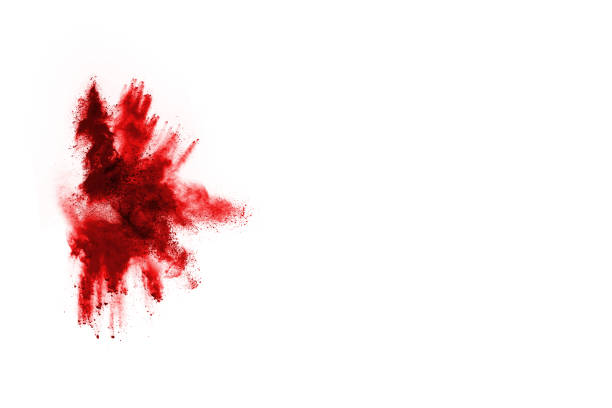 istock Freeze motion of red powder exploding, isolated on white background. Abstract design of red dust cloud. Particles explosion screen saver, wallpaper 1077671606