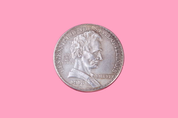 istock half dollar coin isolated on pink background 1077672068
