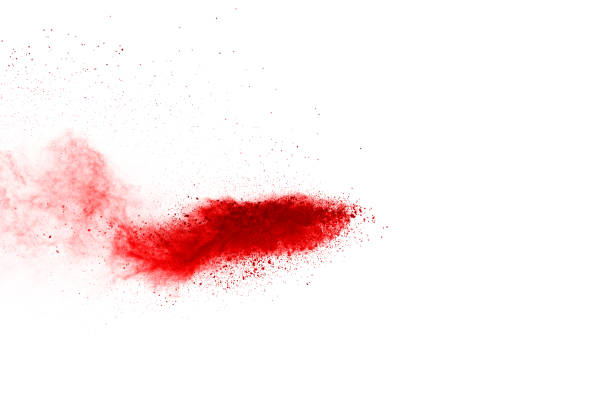 istock Freeze motion of red powder exploding, isolated on white background. Abstract design of red dust cloud. Particles explosion screen saver, wallpaper 1077677680