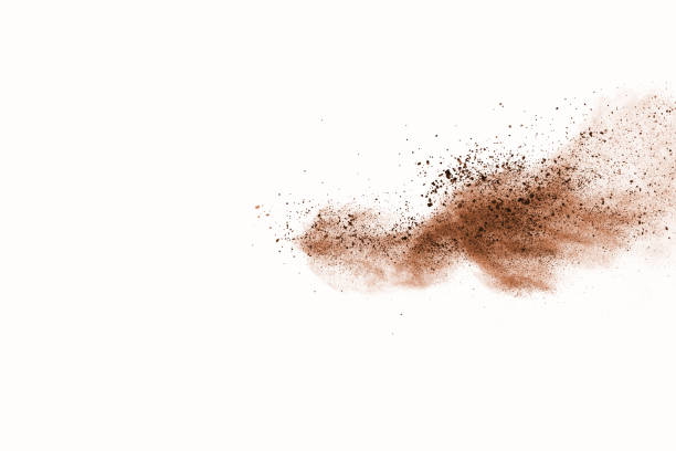 istock Brown color powder explosion on white background. Colored cloud. Colorful dust explode. Paint Holi. 1077678710