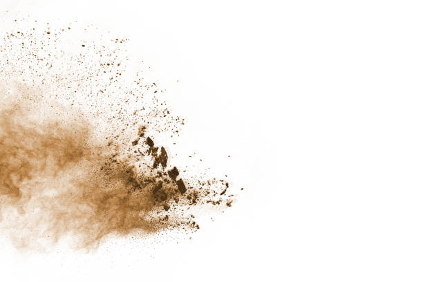 istock Brown color powder explosion on white background. Colored cloud. Colorful dust explode. Paint Holi. 1077678784