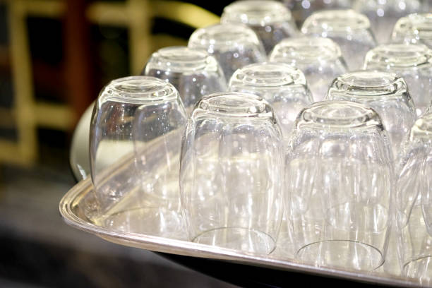 istock Many empty glasses of thin, transparent glass on the buffet table. Soft focus, selective focus 1077681330