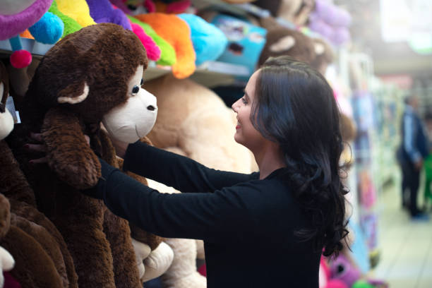 istock Young girl shops for toys 1077683862