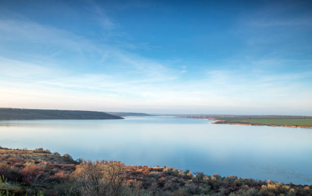 istock blue sky and clouds, blue lake stil water, panoramic view from high 1077689566