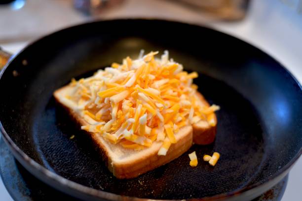 istock Old Fashioned cheese sandwich with Grated Cheese on slice of bread 1077690620