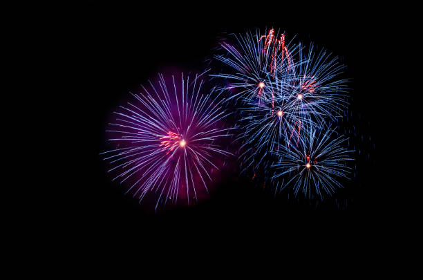 istock colorful fireworks on the black sky background over-water 1077700266