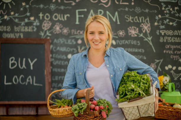 istock Farmers' market stall owner 1077701968