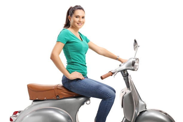 istock Young female sitting on a vintage scooter 1077702180