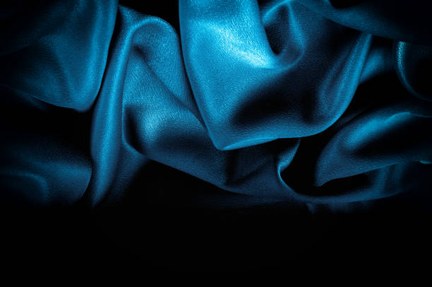 istock Texture, background. template. Silk fabric blue, Blue silk drapery and upholstery fabric from the courtyard - Dark curtains - Solid fabrics for backs and pillows 1077704608