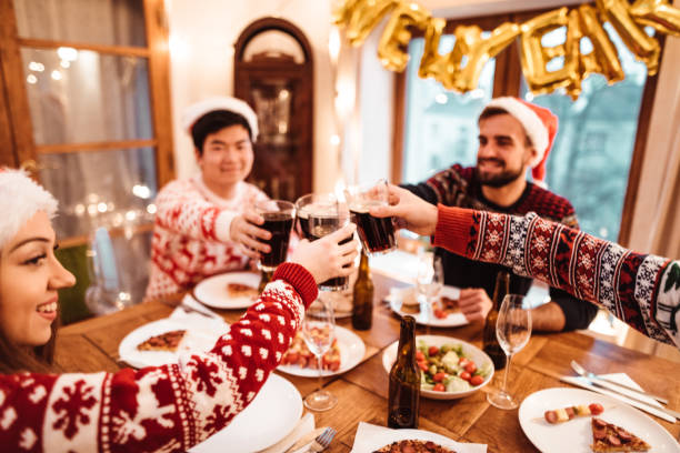 istock friends toasting at home for christmas 1077706940