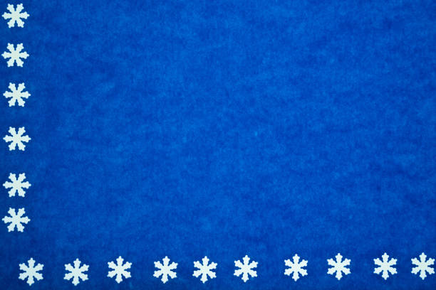 istock blue paper texture with snowflakes as background 1077708192