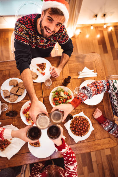 istock friends toasting for dinner at home 1077710716