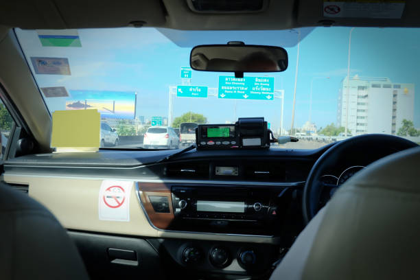 istock Passenger view, taxi meter, male driver, on express way 1077718654