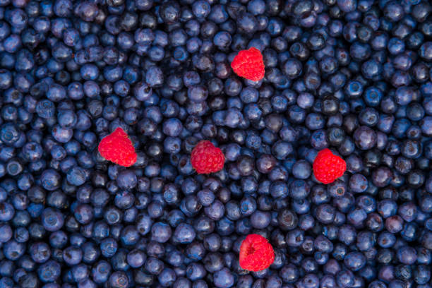 istock Full Frame Shot Of Blueberries And Raspberries 1077719316