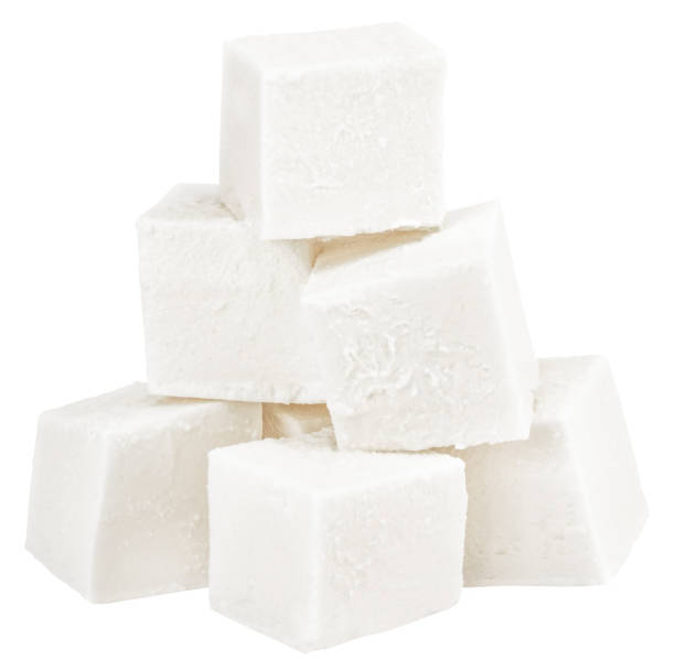 istock Heap of diced soft cheese isolated on white background 1077720494