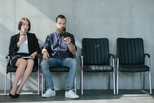 istock waiting job interview woman man applicants 1077723610
