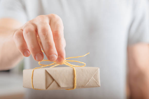 istock shop order delivery man box wrapped craft paper 1077723620