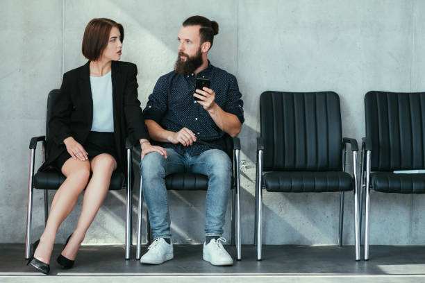 istock woman touch man knee work harassment seduction 1077723624