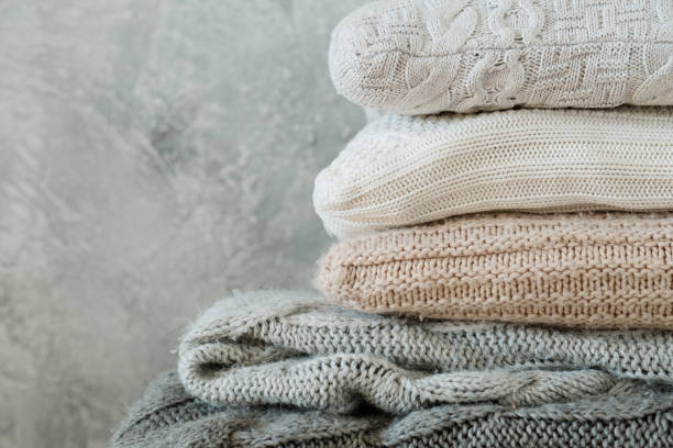 istock pile folded cozy knitted plaids pillows home decor 1077723918