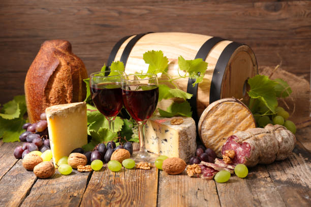 istock red wine glasses with cheese and salami 1077727070